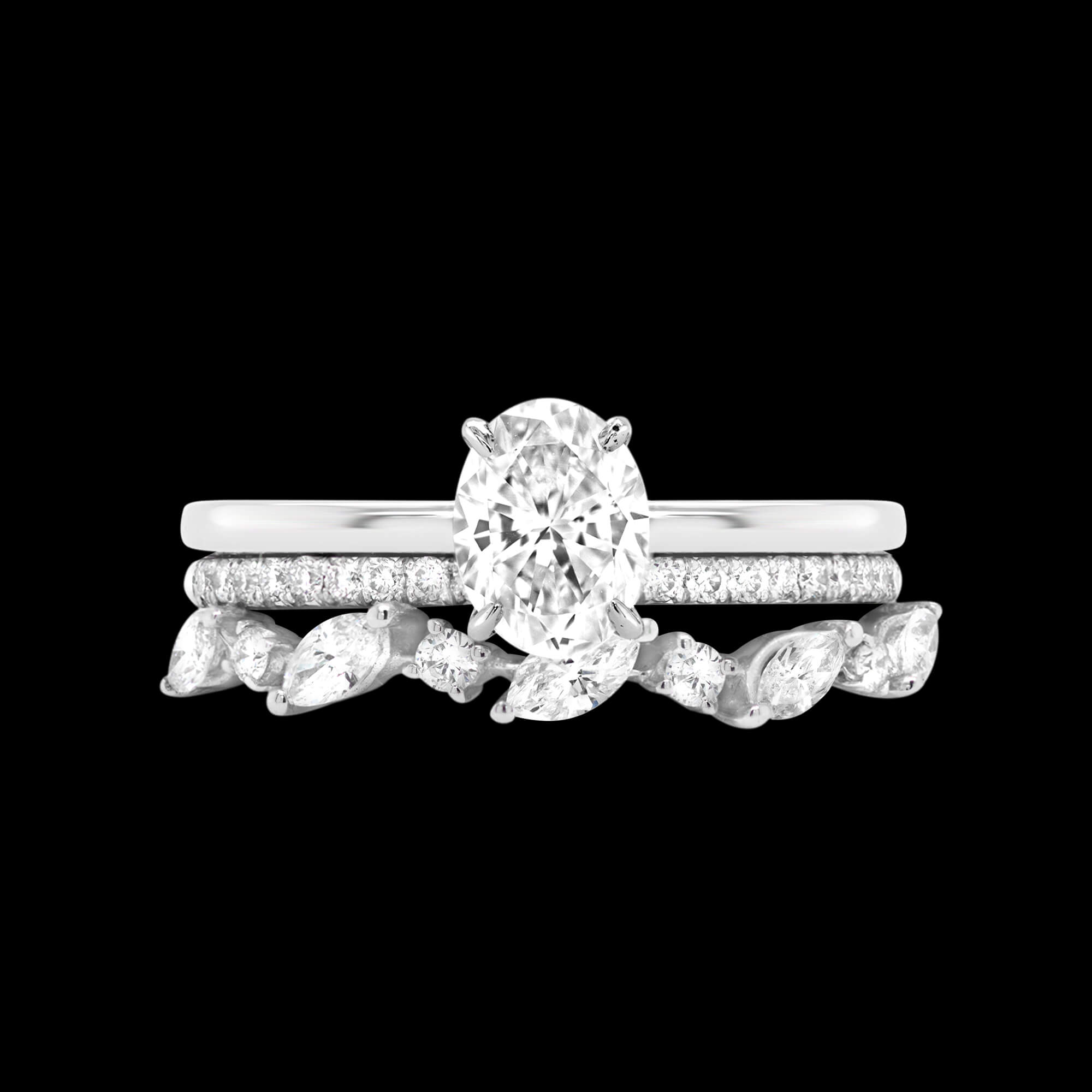 Custom 18kt white gold engagement ring with an oval centre diamond and pave-set diamond hidden halo with wedding bands | Classic. FRIDA | Fine Jewellery.