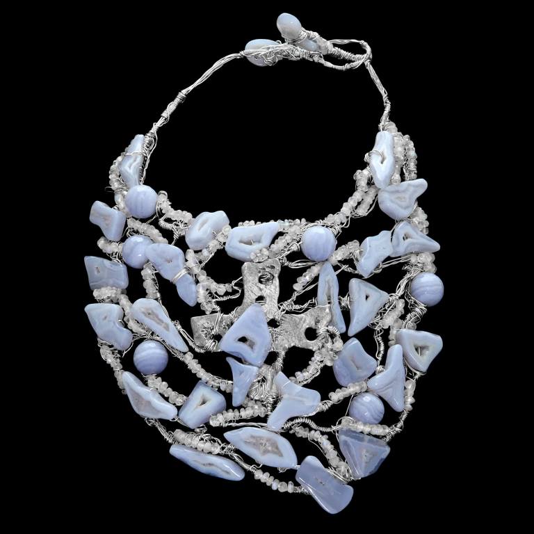 Custom hand-woven Sky neck sculpture with blue lace agate, moonstone and a sterling silver sculpture | Caribou Collection. FRIDA | Fine Jewellery.