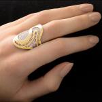Custom 18kt yellow and white gold Fjord ring with pavé-set diamonds. Side perspective | Ocean Collection. FRIDA | Fine Jewellery.