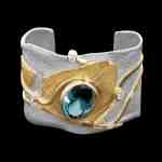 Custom sterling silver and 18kt yellow gold Astrid cuff bracelet with aquamarine and diamonds. Front | Shield Collection. FRIDA | Fine Jewellery.