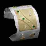 Custom sterling silver and 18kt yellow gold Navi cuff with diamonds and emeralds | Shield Collection. FRIDA | Fine Jewellery.