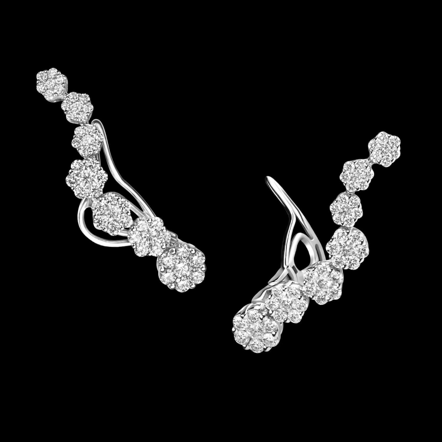 Custom 18kt white gold wave climber earrings with diamond clusters. FRIDA | Fine Jewellery.