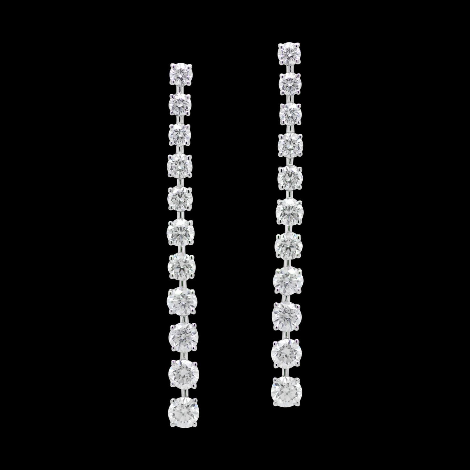 Custom 18kt white gold dangle earrings with 22 graduated floating brilliant-cut diamonds. FRIDA Fine Jewellery.