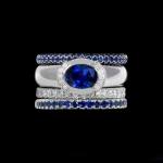 Custom 18kt white gold Luna ring with a royal blue sapphire and diamonds with matching bands. Signature Engagement | Celestial Collection. FRIDA | Fine Jewellery.