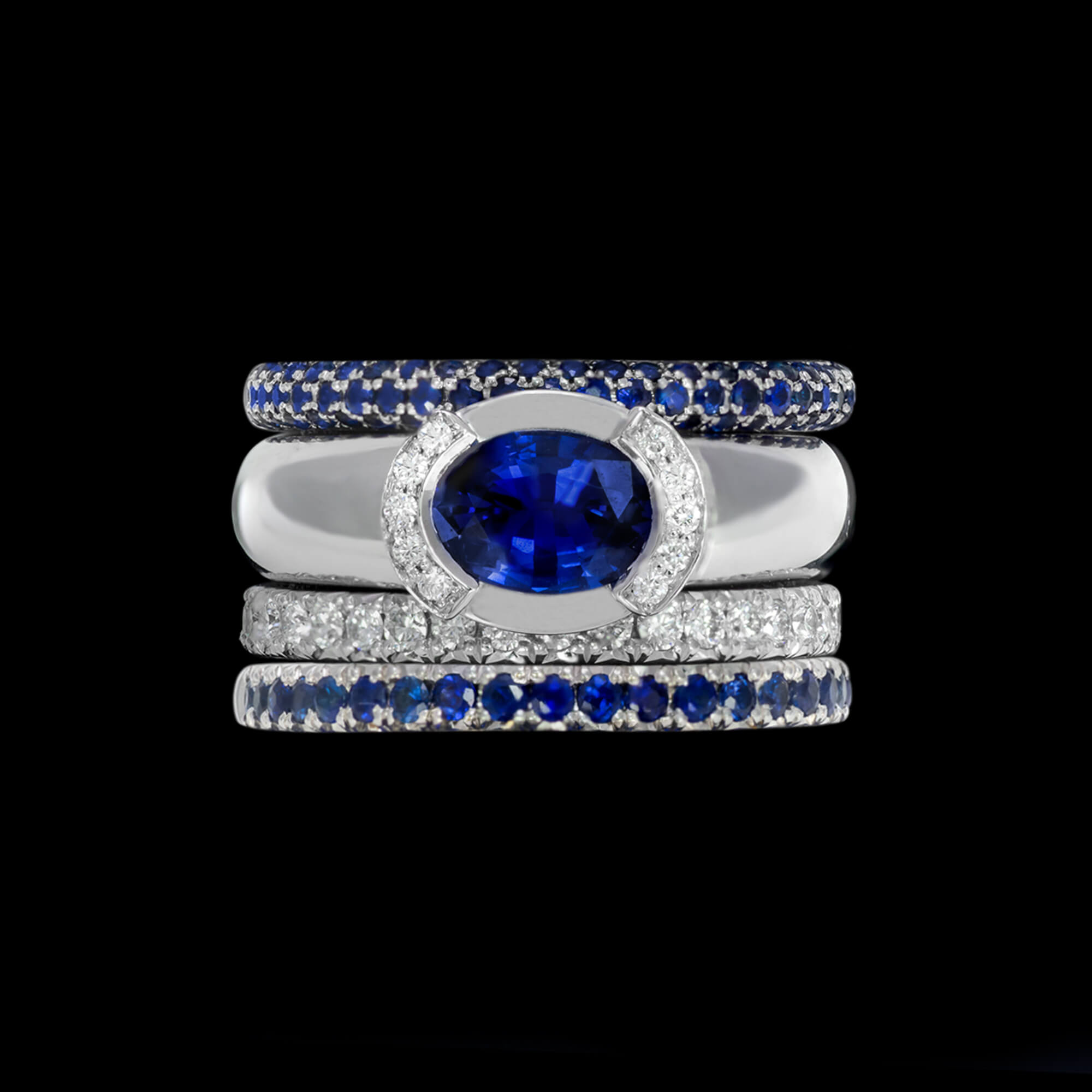 Custom 18kt white gold Luna ring with a royal blue sapphire and diamonds with matching bands. Signature Engagement | Celestial Collection. FRIDA | Fine Jewellery.