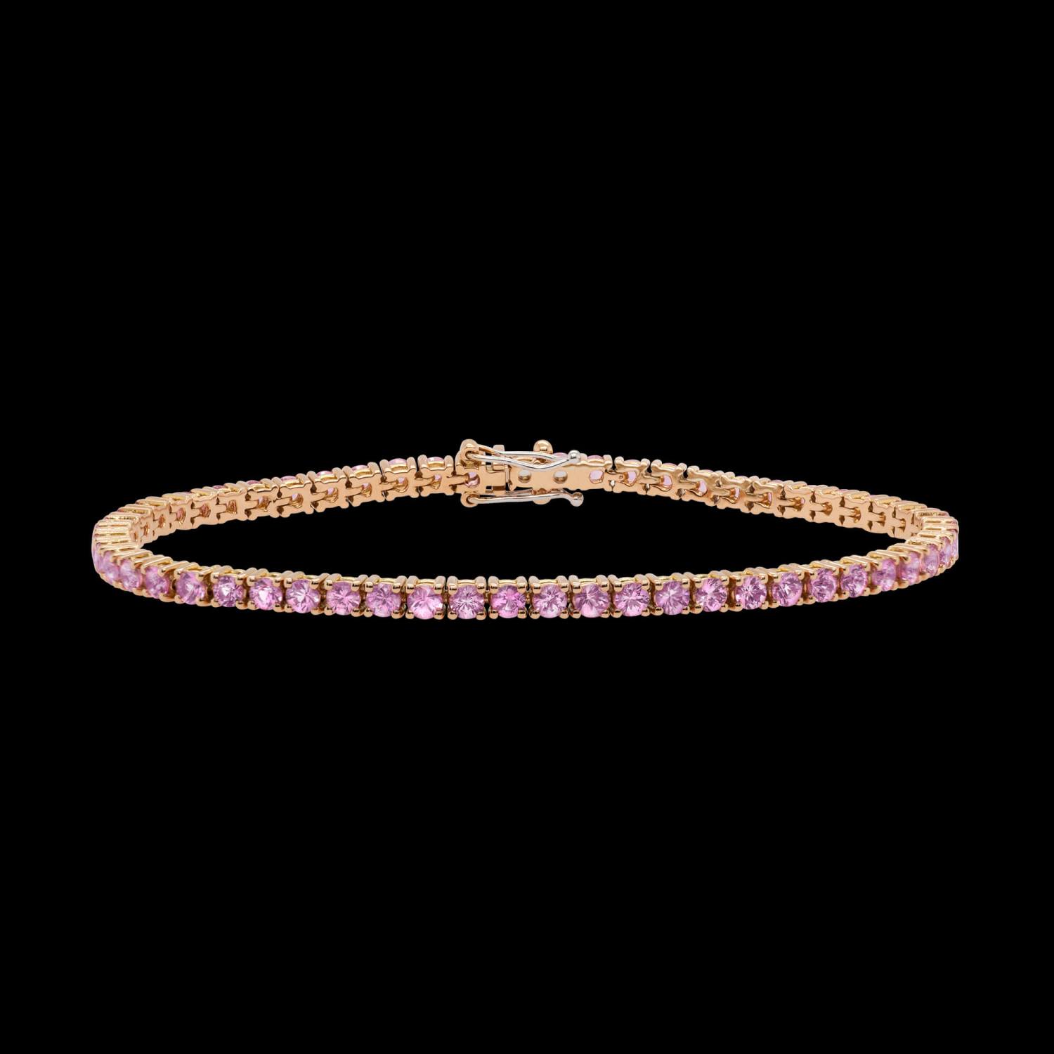 Custom 18kt pink gold tennis bracelet with an ombré of graduated pink sapphires. Front. FRIDA | Fine Jewellery.