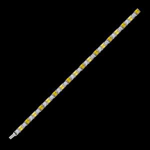 Custom 18kt white gold tennis bracelet with yellow sapphire baguettes and brilliant-cut diamonds. Full. FRIDA | Fine Jewellery.