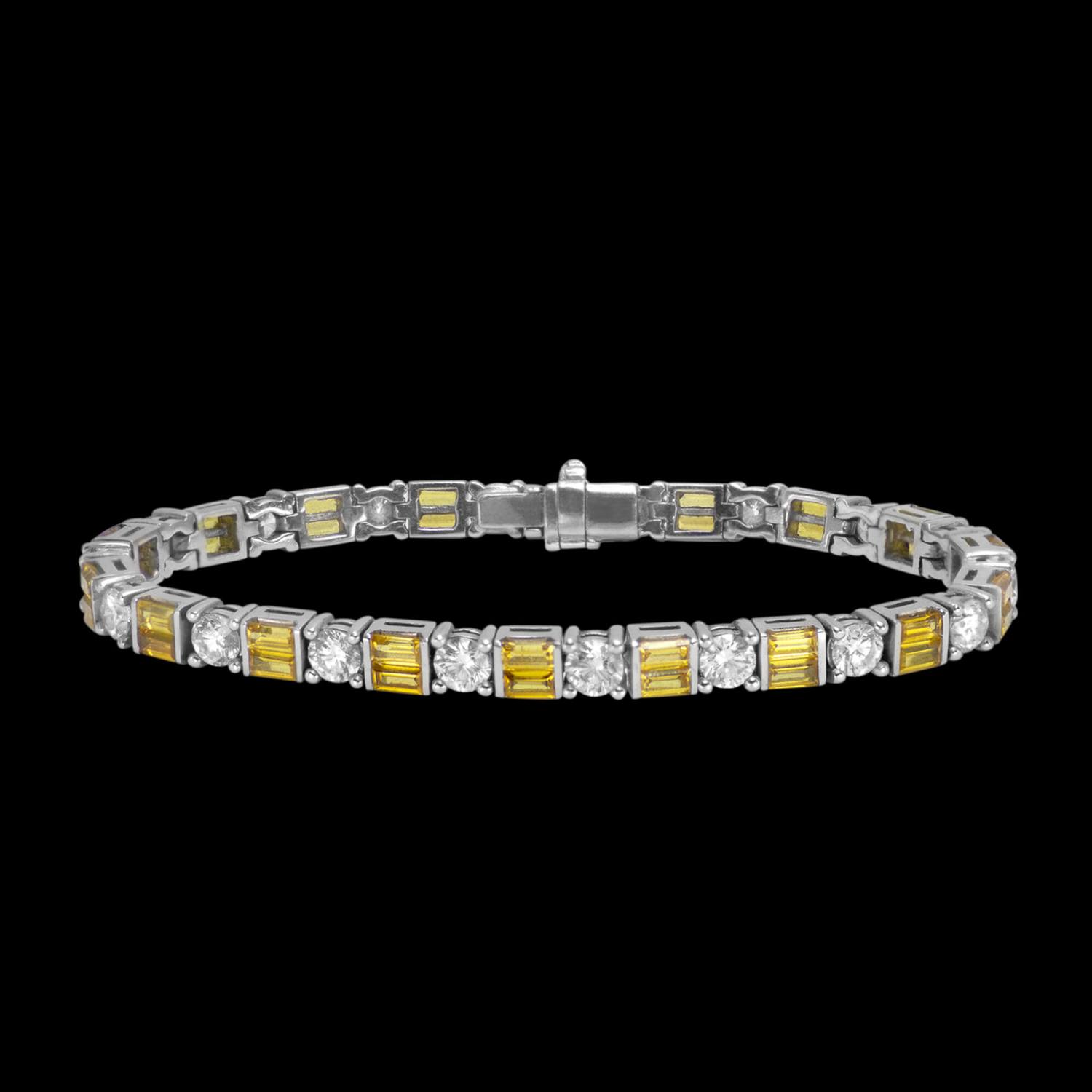 Custom 18kt white gold tennis bracelet with yellow sapphire baguettes and brilliant-cut diamonds. Front. FRIDA | Fine Jewellery.