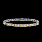 Custom 18kt white gold tennis bracelet with yellow sapphire baguettes and brilliant-cut diamonds. Front. FRIDA | Fine Jewellery.