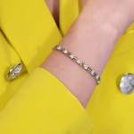 Custom 18kt white gold tennis bracelet with yellow sapphire baguettes and brilliant-cut diamonds. Perspective. FRIDA | Fine Jewellery.
