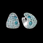 Custom 18kt white gold triangle huggie earrings with pavé-set blue diamonds. FRIDA | Fine Jewellery.