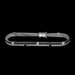 Custom 18kt white gold two-row tennis bracelet with black and white diamonds. FRIDA | Fine Jewellery.