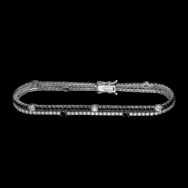 Custom 18kt white gold two-row tennis bracelet with black and white diamonds. FRIDA | Fine Jewellery.