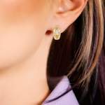 Custom 18kt yellow gold huggie earrings with pear-shaped diamonds. Perspective. FRIDA | Fine Jewellery.