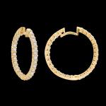 Custom 18kt yellow gold medium round hoops with prong-set diamonds. Side. FRIDA | Fine Jewellery.