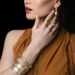 Custom 18kt gold Shield cuff and bangle with yellow sapphires, sapphire rings and South Sea pearl earrings. Shield. Model. FRIDA | Fine Jewellery.