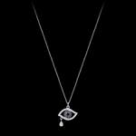 Custom 18kt white gold evil eye necklace set with diamonds and blue sapphires. FRIDA | Fine Jewellery.