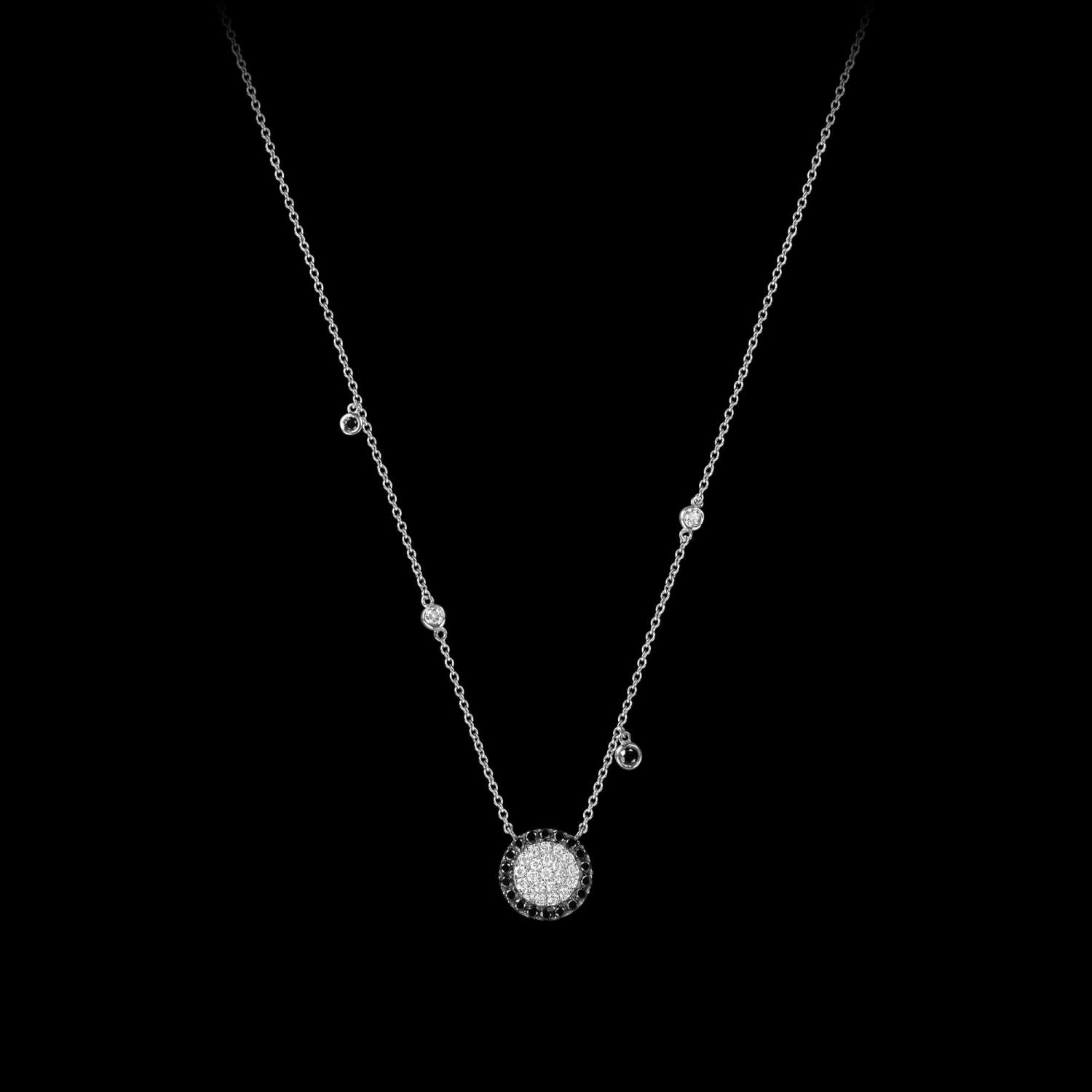 Custom 18kt white gold floating disk necklace with white and black diamonds. FRIDA | Fine Jewellery.