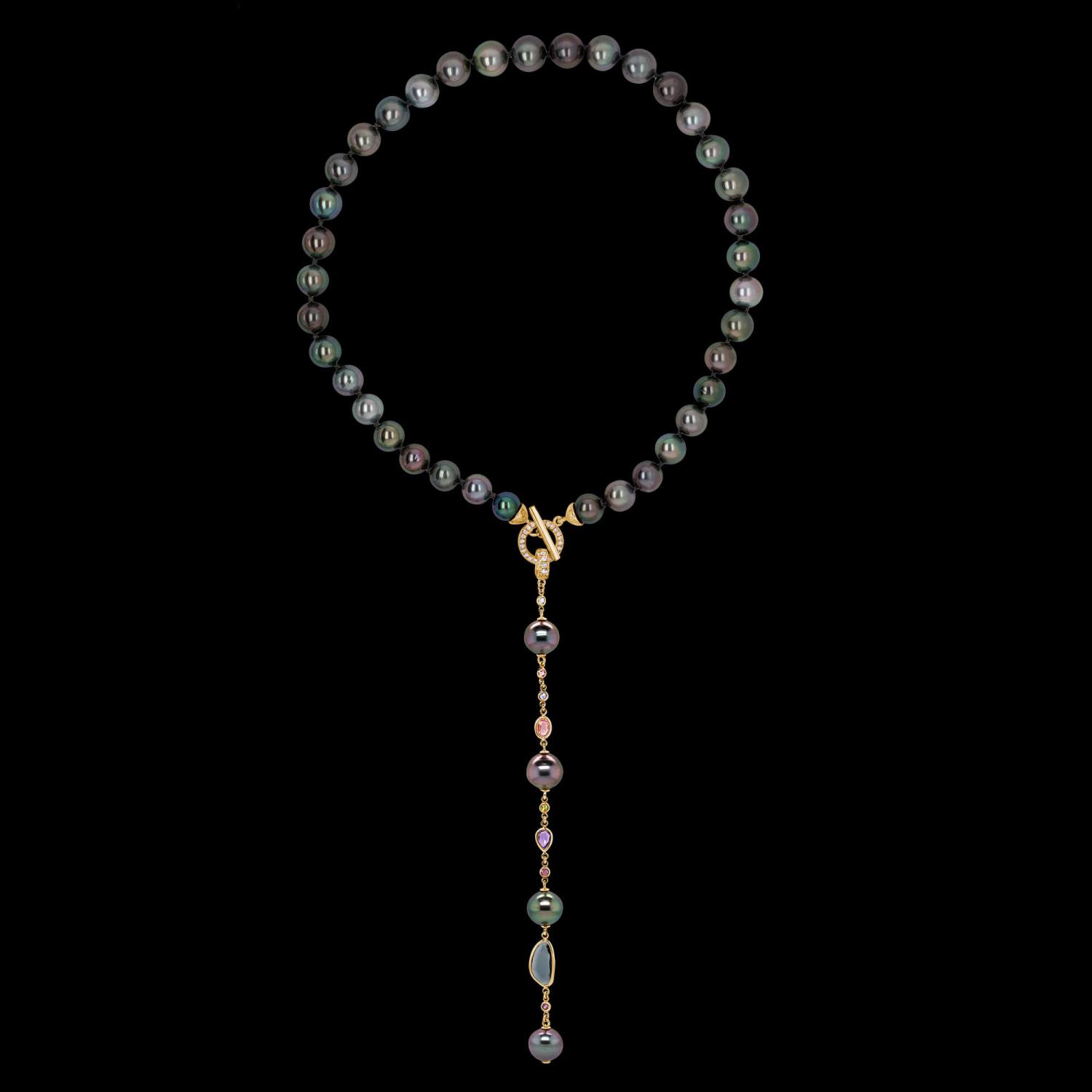 Custom 18kt yellow gold hand-knotted detachable Tahitian pearl lariat necklace featuring sliced sapphires and diamonds. Open. FRIDA | Fine Jewellery.