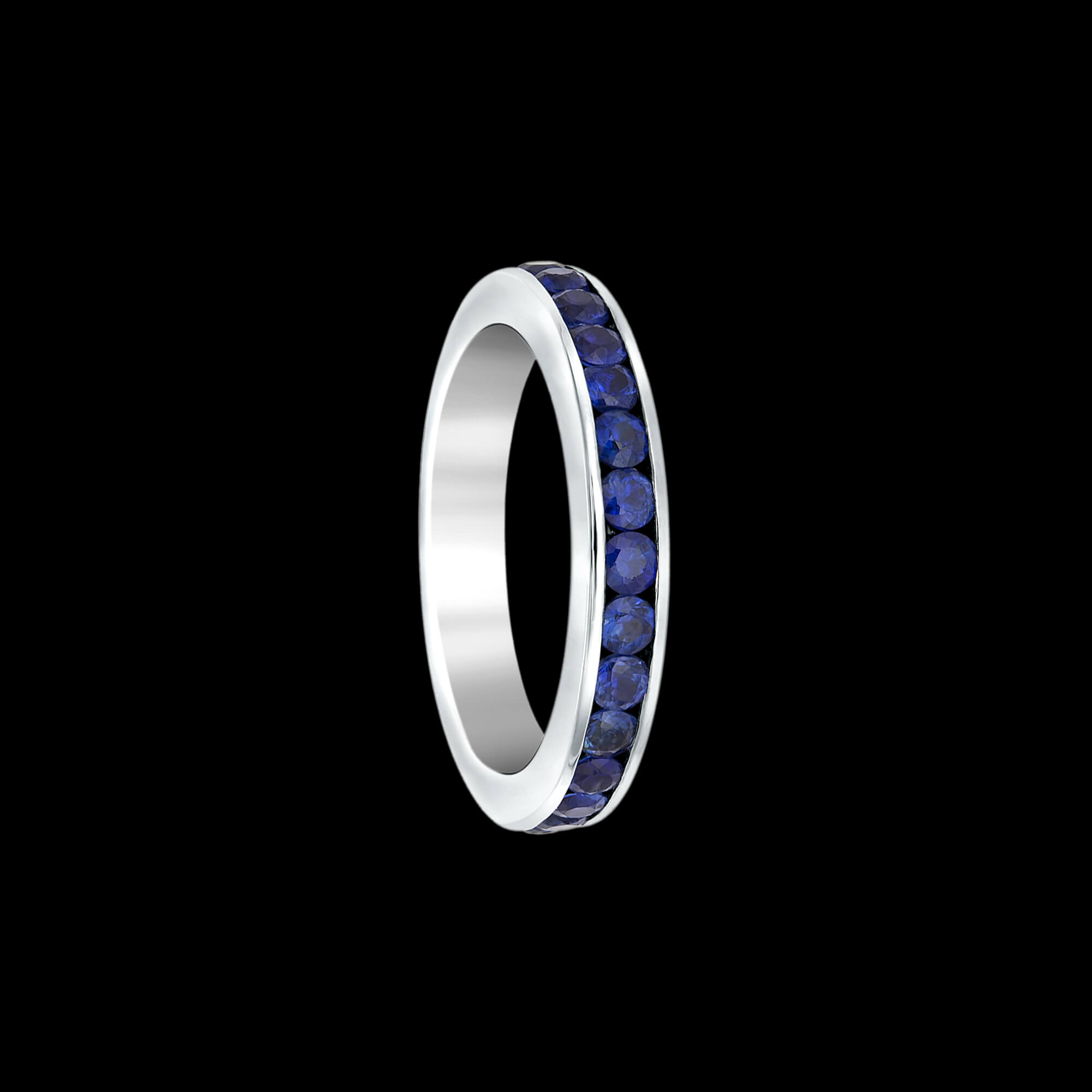 Custom 18kt white gold eternity wedding band ring with blue sapphires. FRIDA | Fine Jewellery.