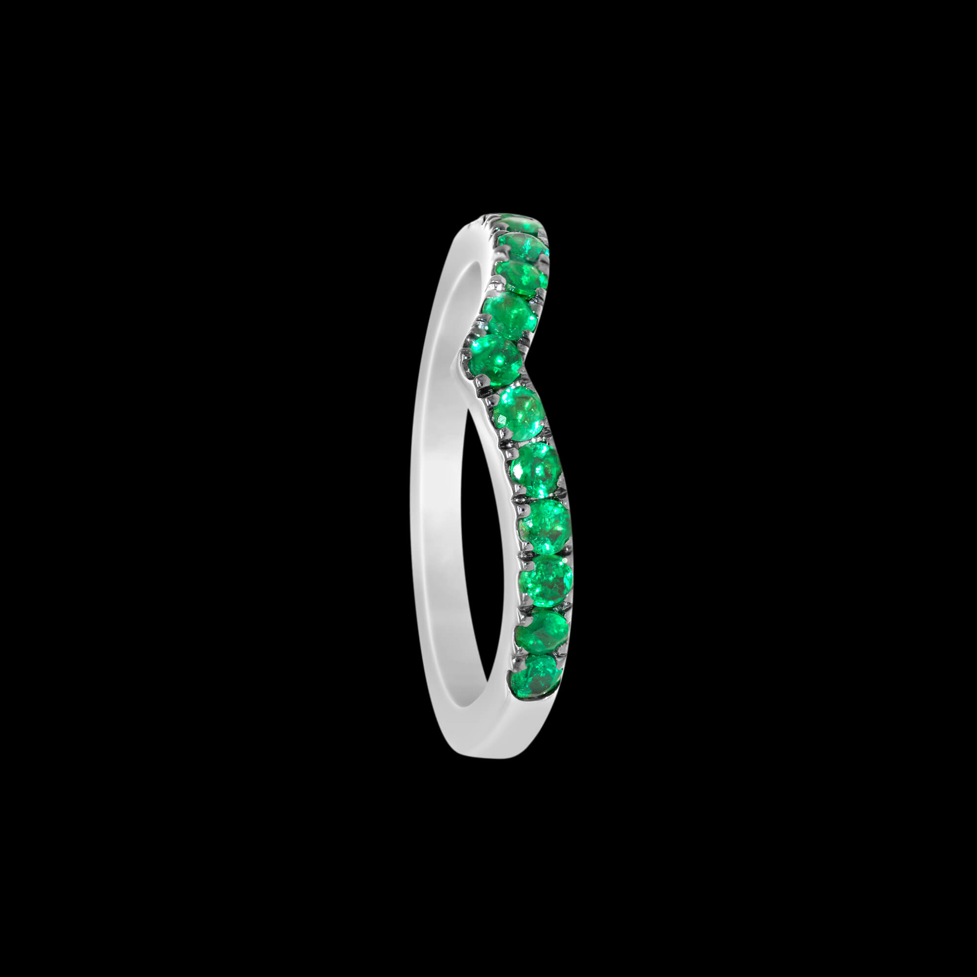 Custom 18kt white gold 'v' wedding band ring with emeralds set in black rhodium. FRIDA Fine Jewellery.