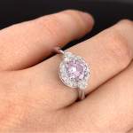 Custom 18kt white gold three stone halo Rania engagement ring with a round pink sapphire and diamonds. Perspective | Classic. FRIDA | Fine Jewellery.