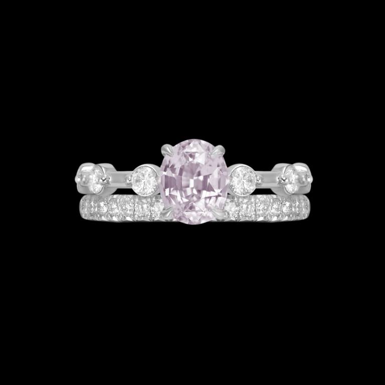 Custom 18kt white gold engagement ring with an oval pink sapphire and diamonds with matching wedding band. Front | Classic. FRIDA | Fine Jewellery.