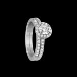 Custom 18kt white gold halo engagement ring with a round diamond and diamond shank with matching wedding band | Classic. FRIDA | Fine Jewellery.
