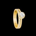 Custom 18kt yellow gold halo engagement ring with a round diamond with diamond wedding band | Classic. FRIDA | Fine Jewellery.