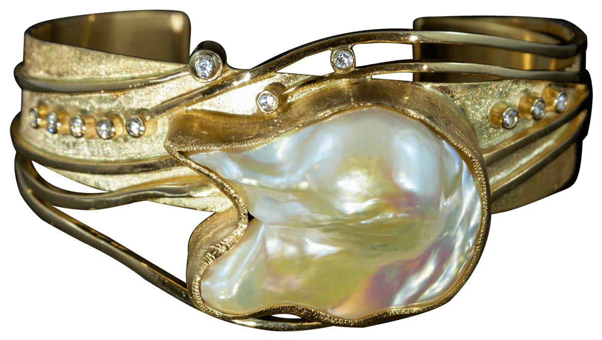 Bespoke 18kt yellow gold cuff with a baroque pearl and diamonds. FRIDA | Fine Jewellery.
