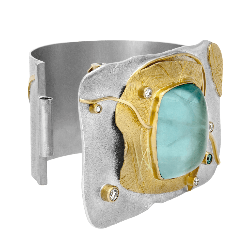 Custom sterling silver and 18kt yellow gold Shackle cuff with a cabochon-cut aquamarine and diamonds. Shackle cuff. Open | Shield™ Collection. FRIDA  Fine Jewellery.
