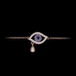 Custom 18kt pink gold evil eye bracelet set with diamonds and blue sapphires. View 1. FRIDA | Fine Jewellery.