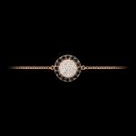 Custom 18kt pink gold floating disk bracelet with white and black diamonds. Front. FRIDA | Fine Jewellery.