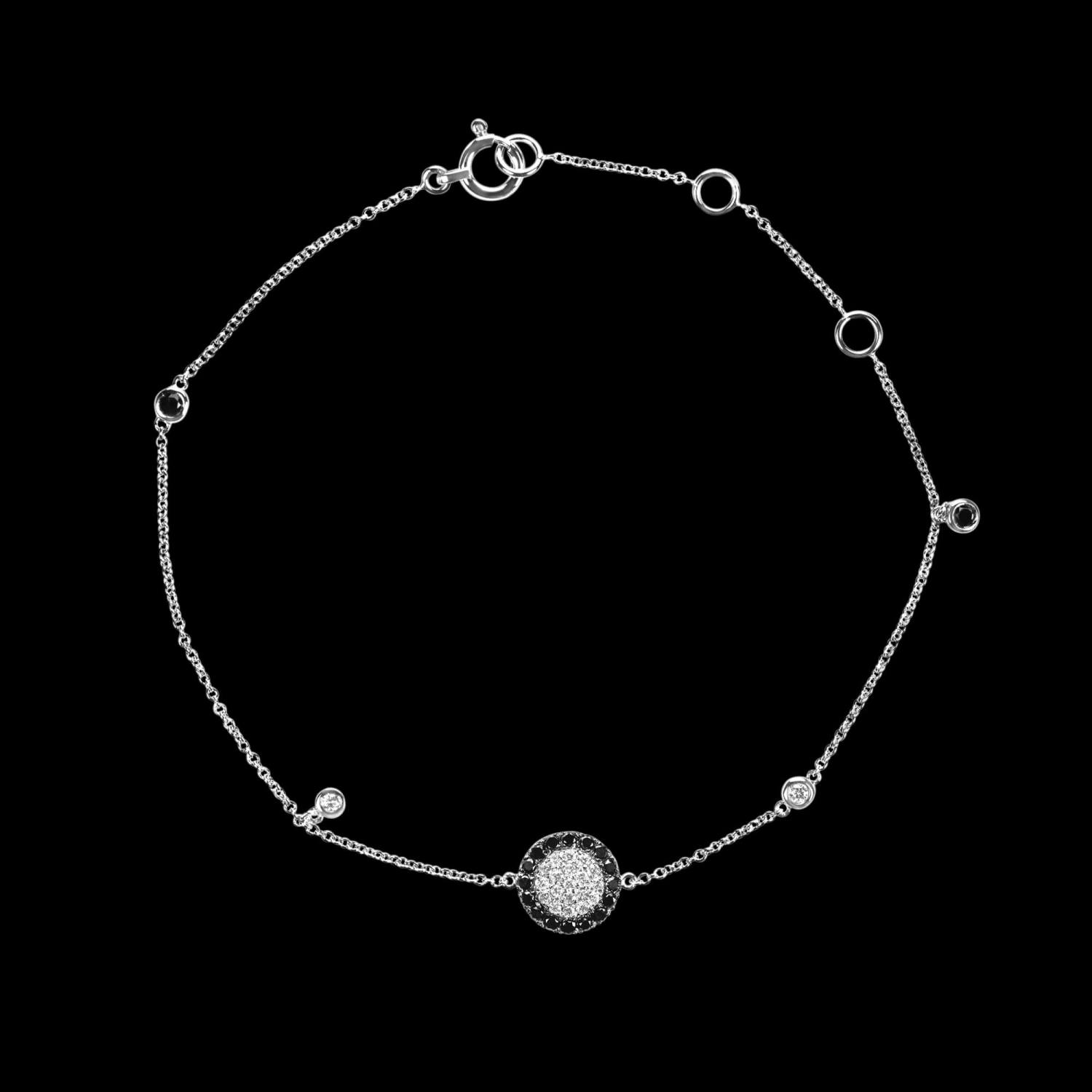 Custom 18kt white gold floating disk bracelet with white and black diamonds. FRIDA | Fine Jewellery.