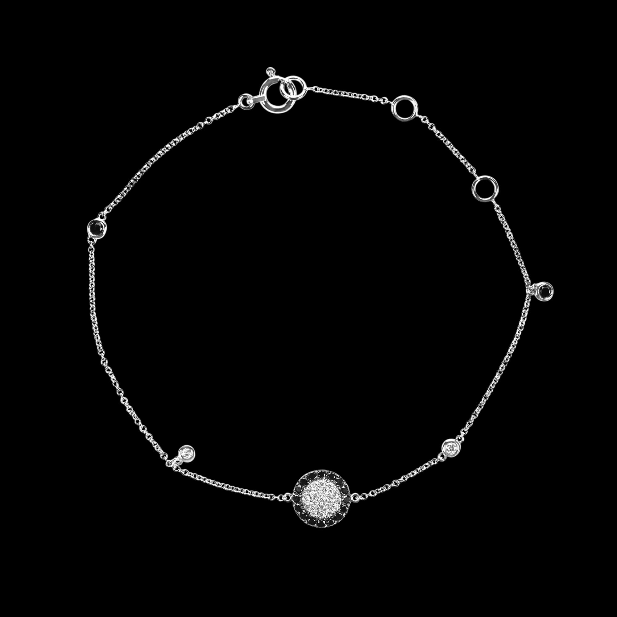 Custom 18kt white gold floating disk bracelet with white and black diamonds. FRIDA | Fine Jewellery.