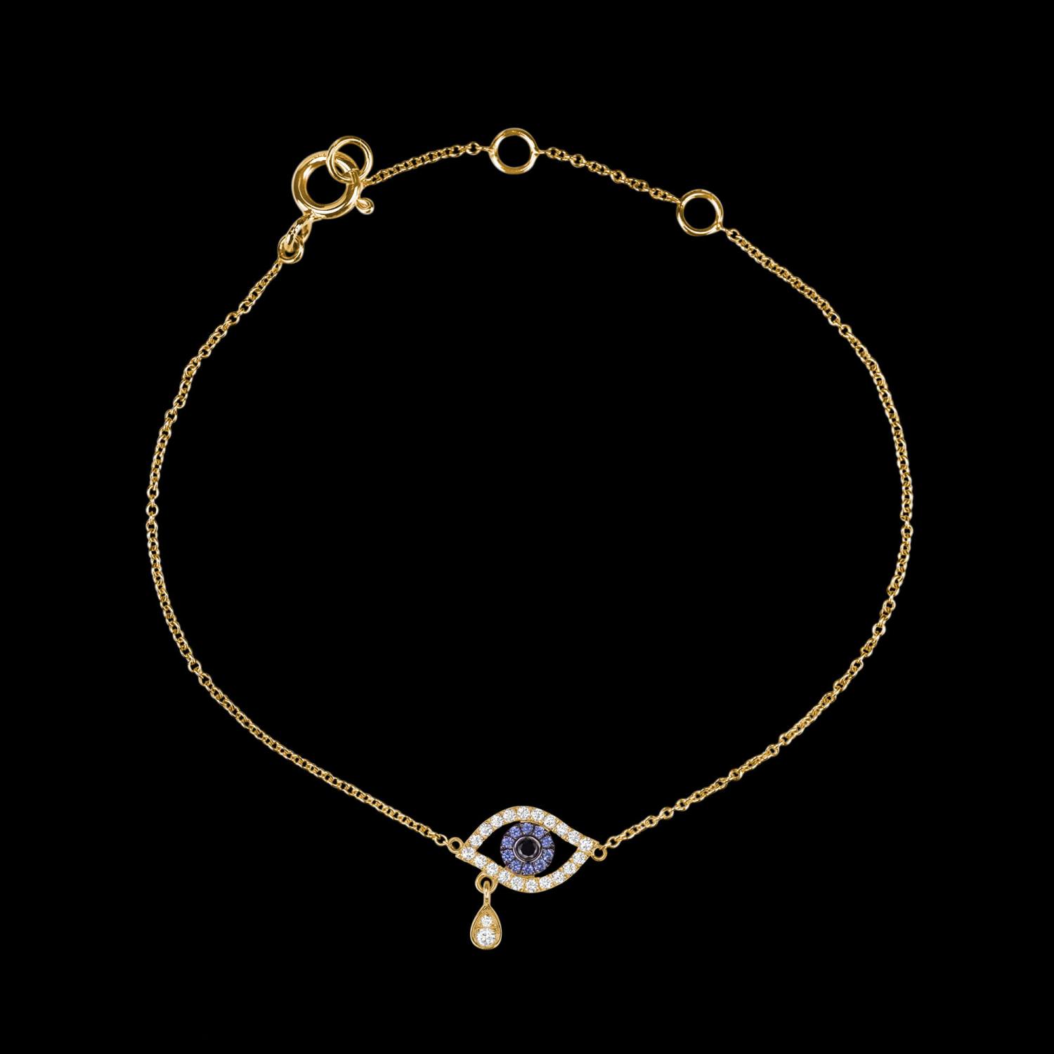 Custom 18kt yellow gold evil eye bracelet set with diamonds and blue sapphires. View 2. FRIDA | Fine Jewellery.