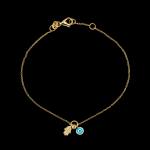 Custom 18kt yellow gold hamsa hand and evil eye bracelet set with diamonds and enamel. View 2. FRIDA | Fine Jewellery.