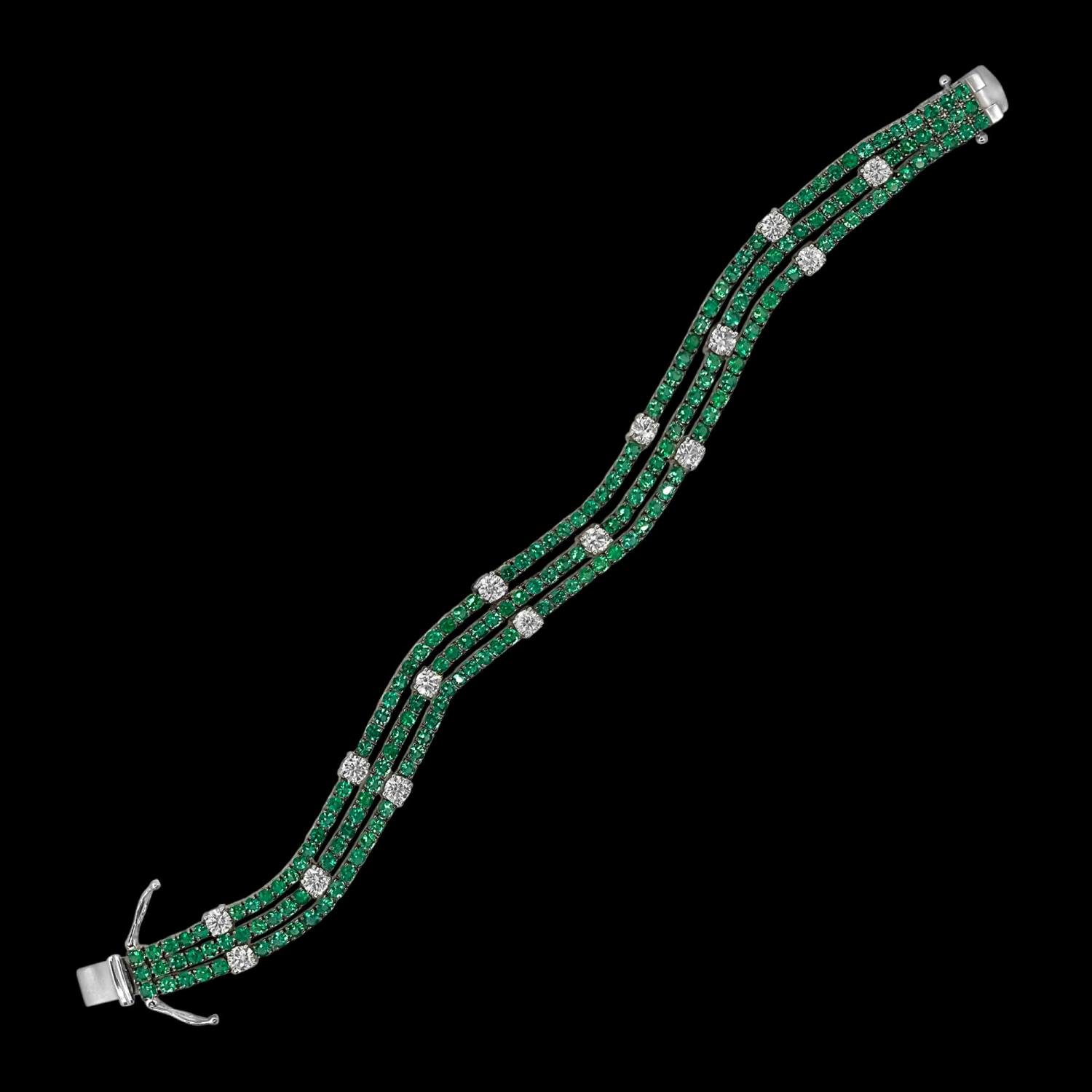 Custom 18kt white gold multi-row tennis bracelet with emeralds and diamonds. FRIDA | Fine Jewellery.