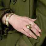 One-of-a-kind 18kt yellow gold statement Èze ring with a moonstone and green sapphires | Shield Collection. FRIDA | Fine Jewellery.
