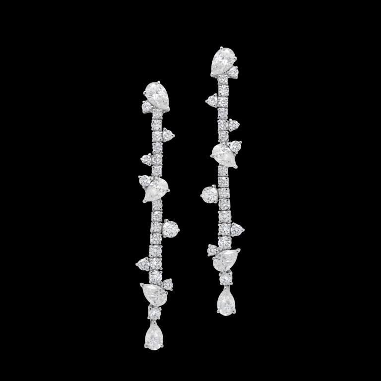 Custom 18kt white gold statement dangle earrings with round and pear shaped diamonds. FRIDA | Fine Jewellery.