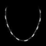 Custom 18kt white gold statement tennis necklace with undulating stations of black and white diamonds. FRIDA | Fine Jewellery.
