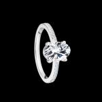 Custom 18kt white gold solitaire with diamonds with prong set oval diamond and diamond shank. FRIDA | Fine Jewellery.
