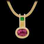 Custom 18kt yellow gold pendant with a pink tourmlaine, tsavorite and diamonds on a gold wheat chain | Shield Collection. FRIDA | Fine Jewellery.