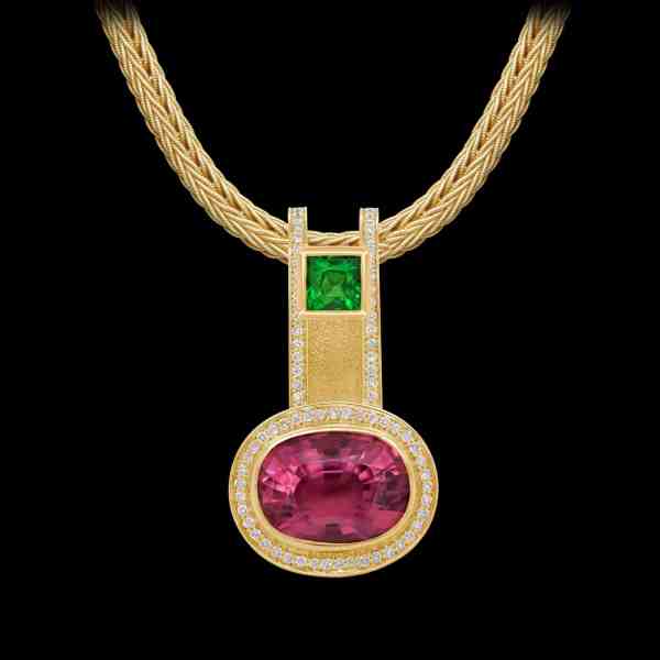 Custom 18kt yellow gold pendant with a pink tourmlaine, tsavorite and diamonds on a gold wheat chain | Shield Collection. FRIDA | Fine Jewellery.